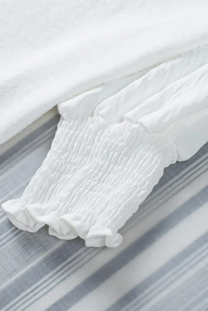 White Shift Top with Elegant Smocked Wrist Detail