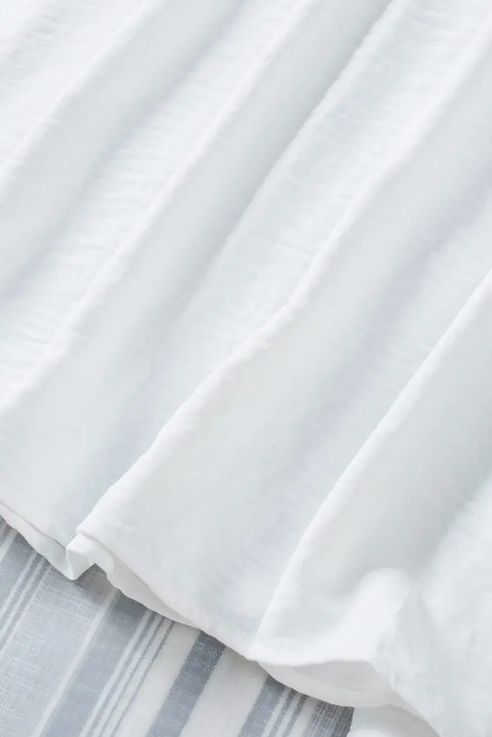 White Shift Top with Elegant Smocked Wrist Detail