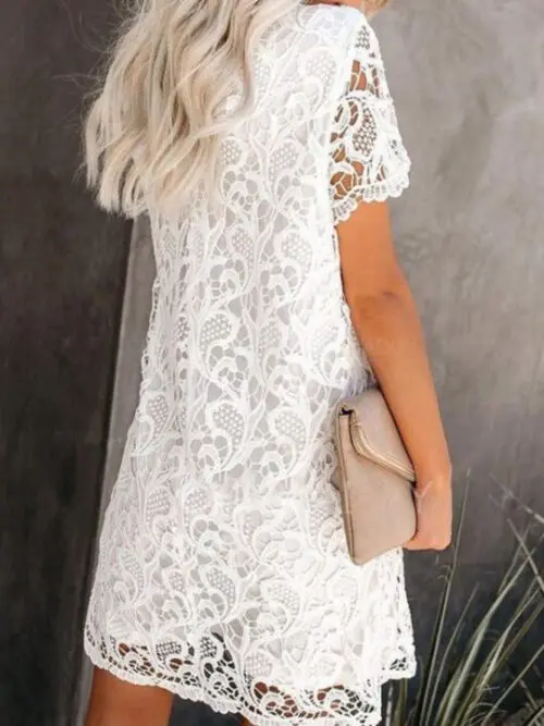 Elegant Round Neck Hollow Lace Midi Dress with a Casual Twist
