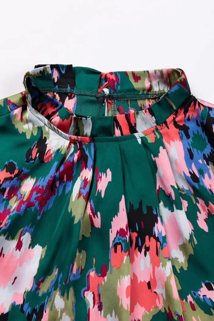 Chic Green Blouse with Abstract Print, Smocked Cuffs, and Frilled Neckline