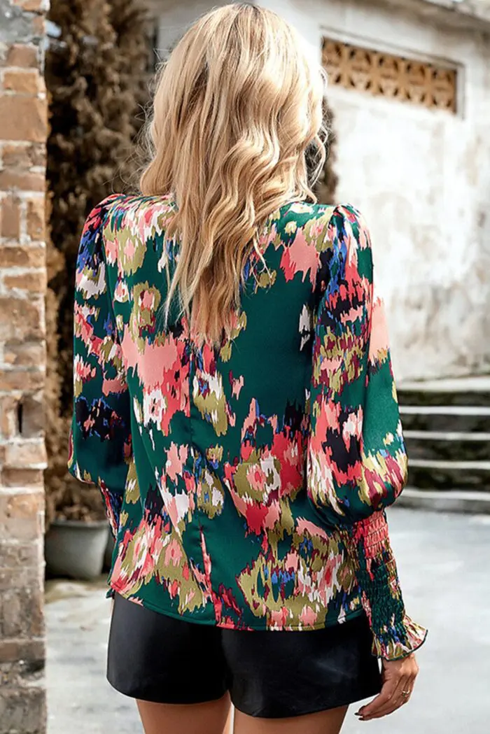Chic Green Blouse with Abstract Print, Smocked Cuffs, and Frilled Neckline