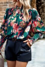 Chic Green Blouse with Abstract Print, Smocked Cuffs, and Frilled Neckline